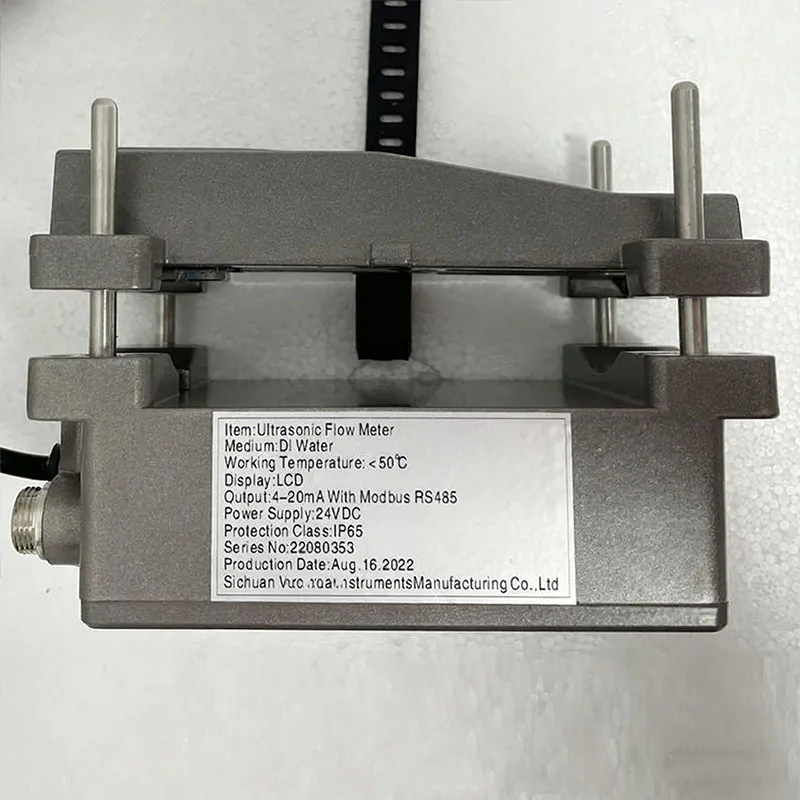 Displays the rear structure of an ultrasonic flow meter, showing the external clamp-on sensor mounting for non-invasive flow measurement.