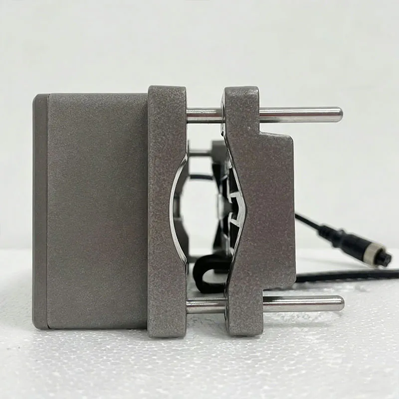 Shows the side view of an ultrasonic flow meter with clamp-on mounting bracket details.