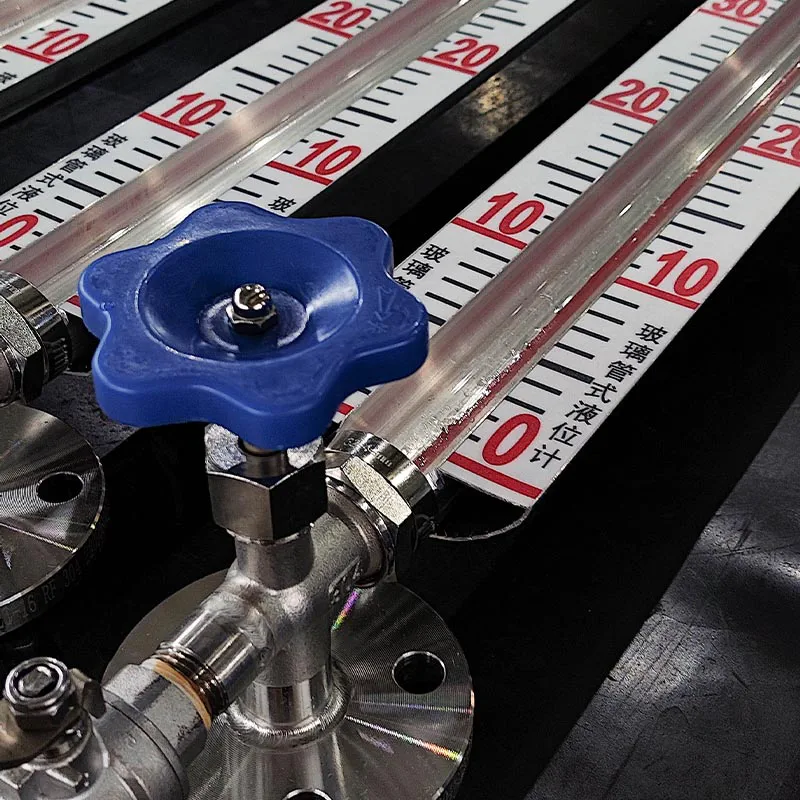Glass tube level gauge detail showing valves, glass tube, and scale plate for visual liquid level measurement in industrial equipment.