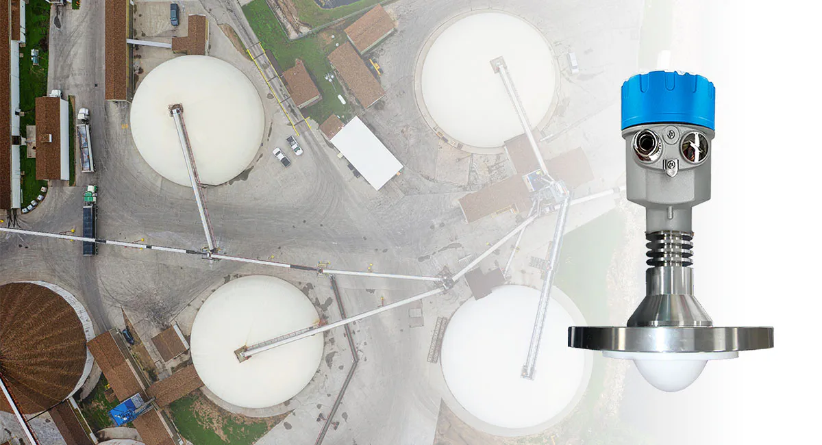 Tank level transmitter application image showing a non-contact radar level transmitter installed on large spherical and circular storage tanks for continuous industrial level measurement.