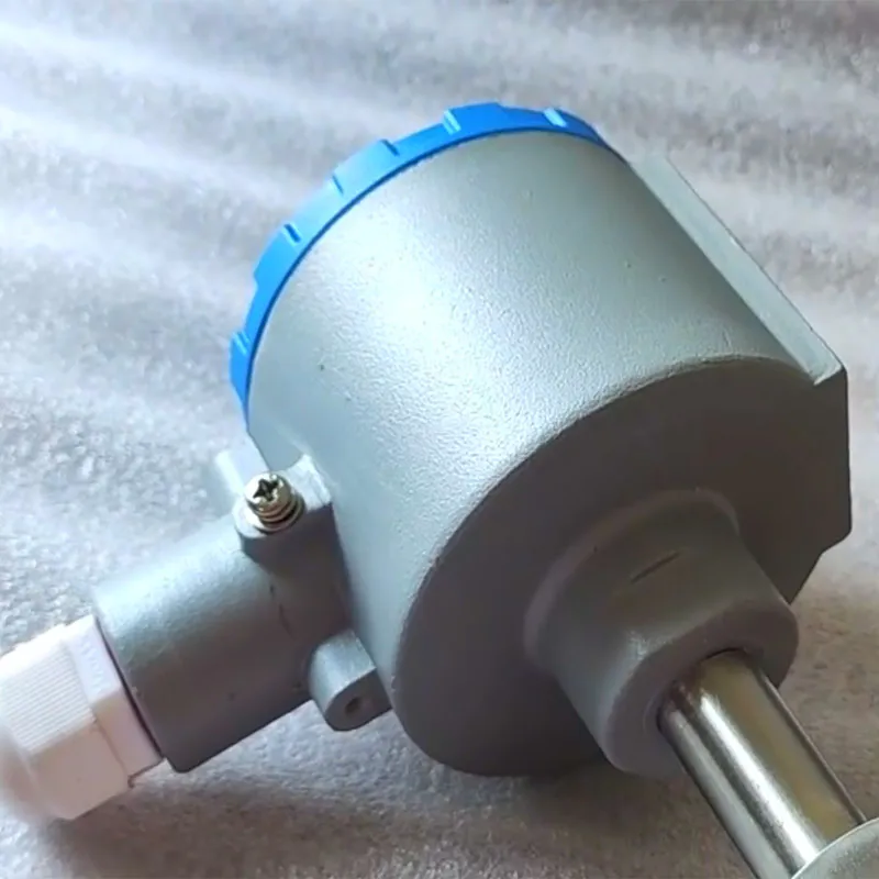 Close-up of a temperature transmitter with sensor probe.