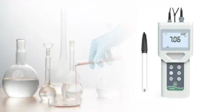 Digital pH meter showing pH value of 7.06 with a laboratory setting.