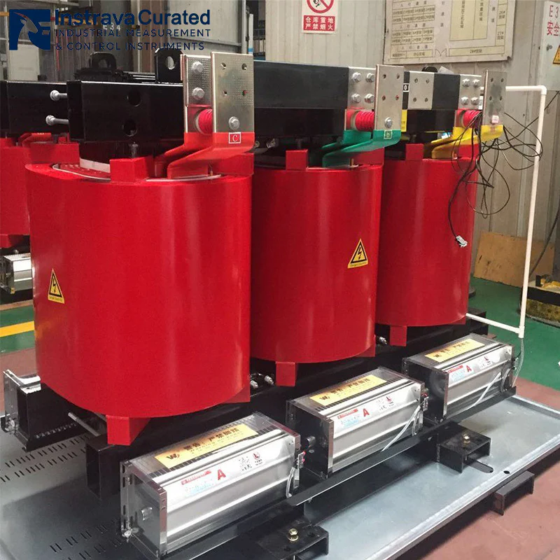 Epoxy dry-type transformer with forced air cooling fans, real shot in factory workshop, for high-load industrial power distribution applications