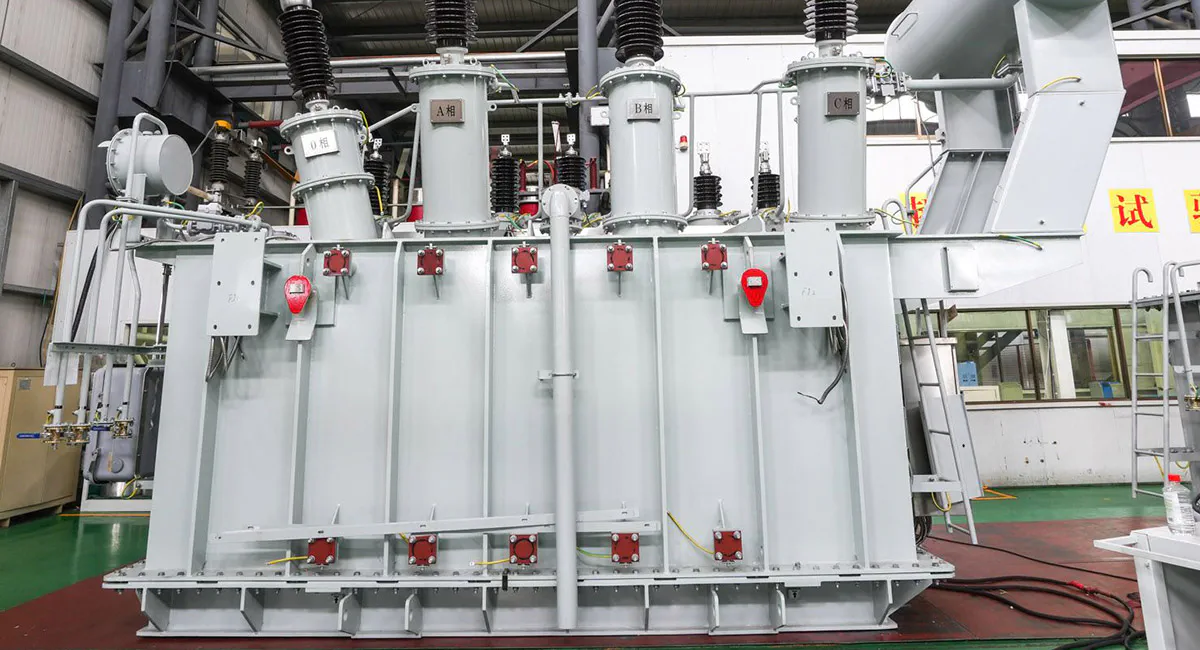 Large oil-immersed power transformer manufactured for high-voltage electrical transmission and distribution applications in power substations.
