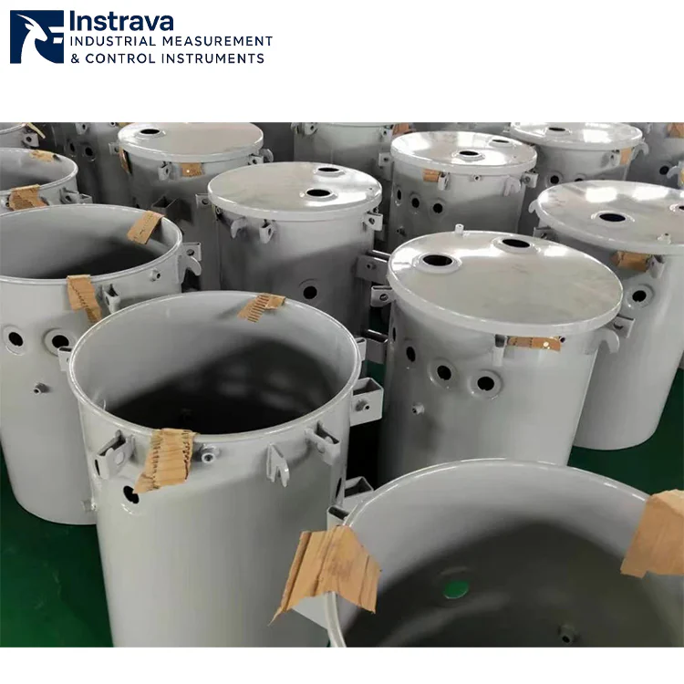 Factory shot of single-phase pole-mounted transformer tank housings in production workshop, batch cylindrical housings ready for assembly, for outdoor distribution transformer manufacturing