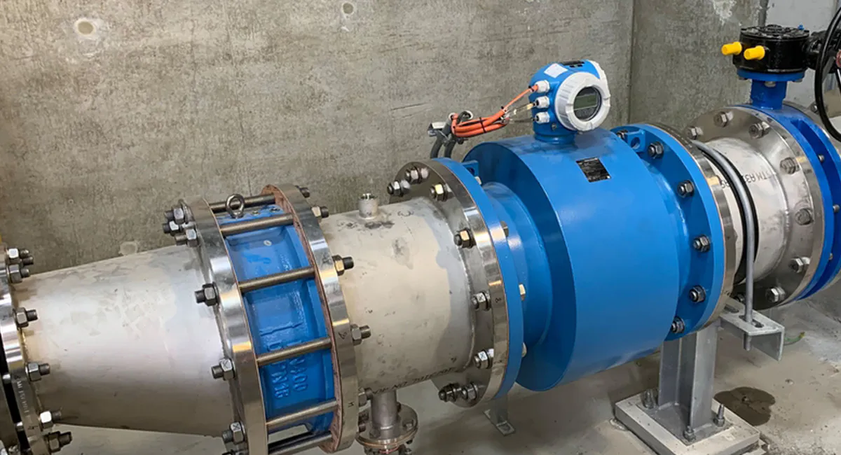 Electromagnetic flow meter installed in industrial pipeline for accurate liquid flow measurement