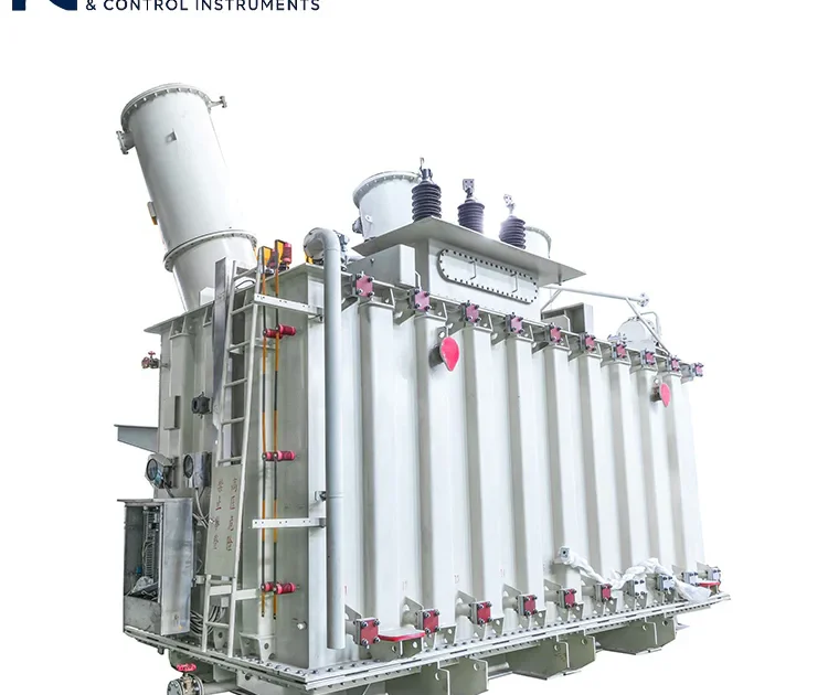 Rear oblique view of three-phase oil-immersed power transformer, showing conservator tank, high-voltage bushings, access ladder and control cabinets, industrial power distribution transformer equipment