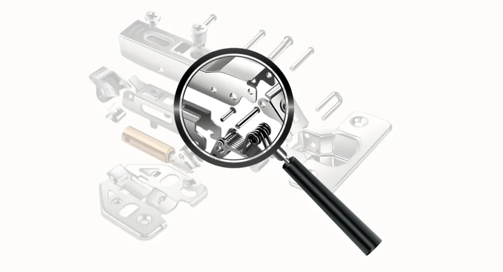 Magnifying glass inspecting the internal mechanism of a concealed cabinet hinge